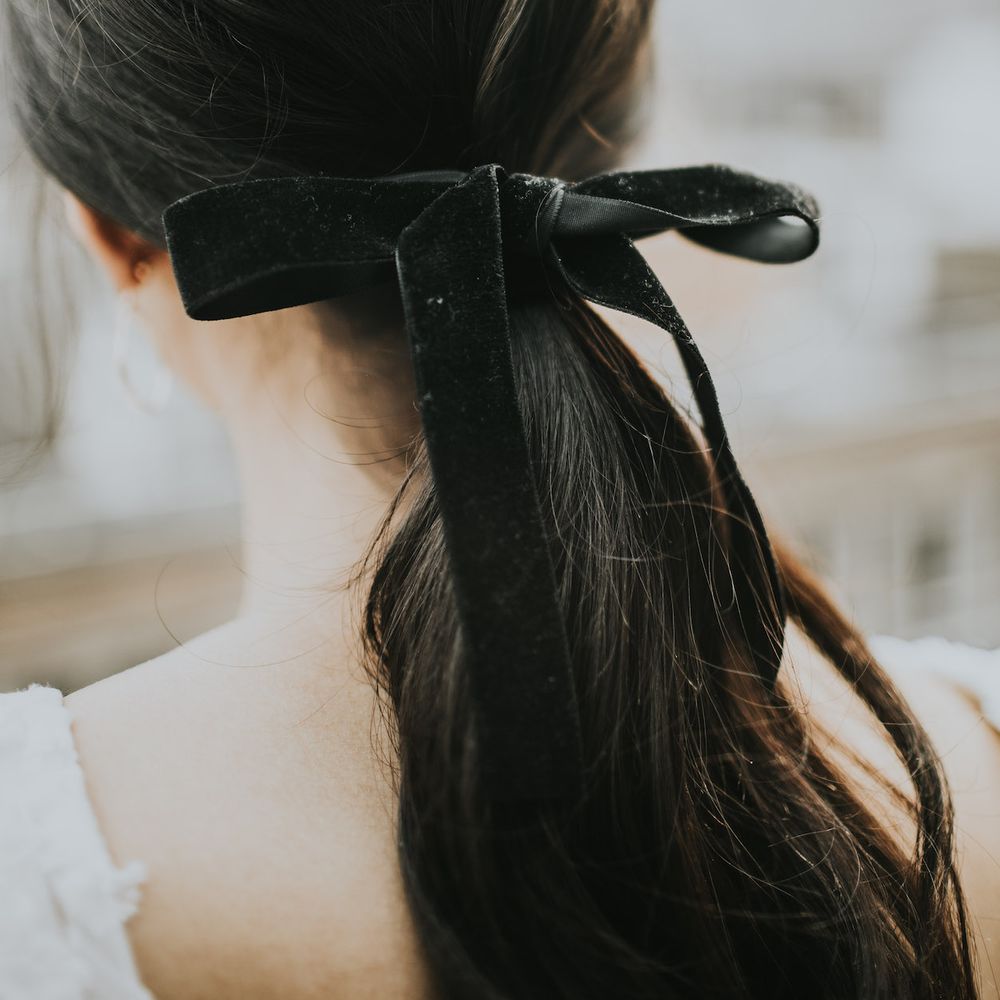 Bridal Ponytail with Black Velvet Ribbon | Minimalist Monochrome Inspiration with Anemone's &amp; White Genista Flowers styled by The Bijou Bride | Igor Demba Photography | Gione da Silva  Film