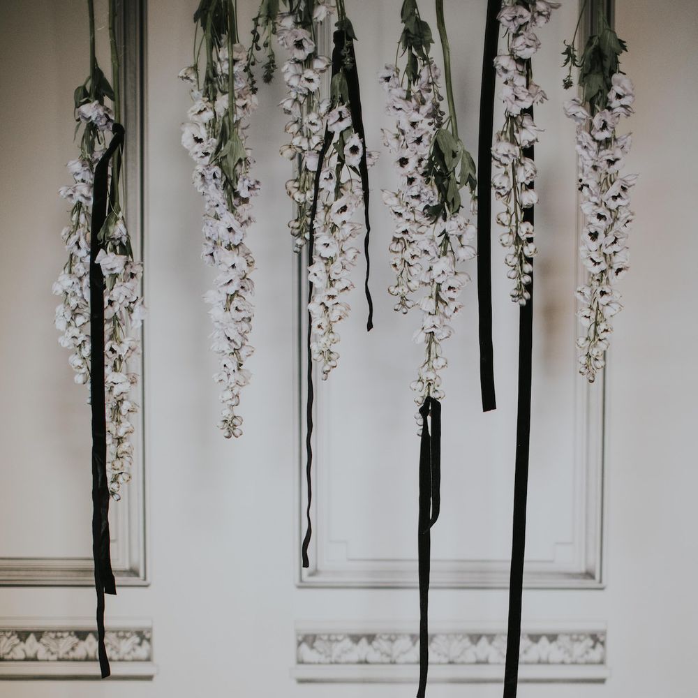 Elegant Tablescape with Ghost Chairs &amp; Hanging Anemone Floral Arrangement | Minimalist Monochrome Inspiration with Anemone's &amp; White Genista Flowers styled by The Bijou Bride | Igor Demba Photography | Gione da Silva  Film