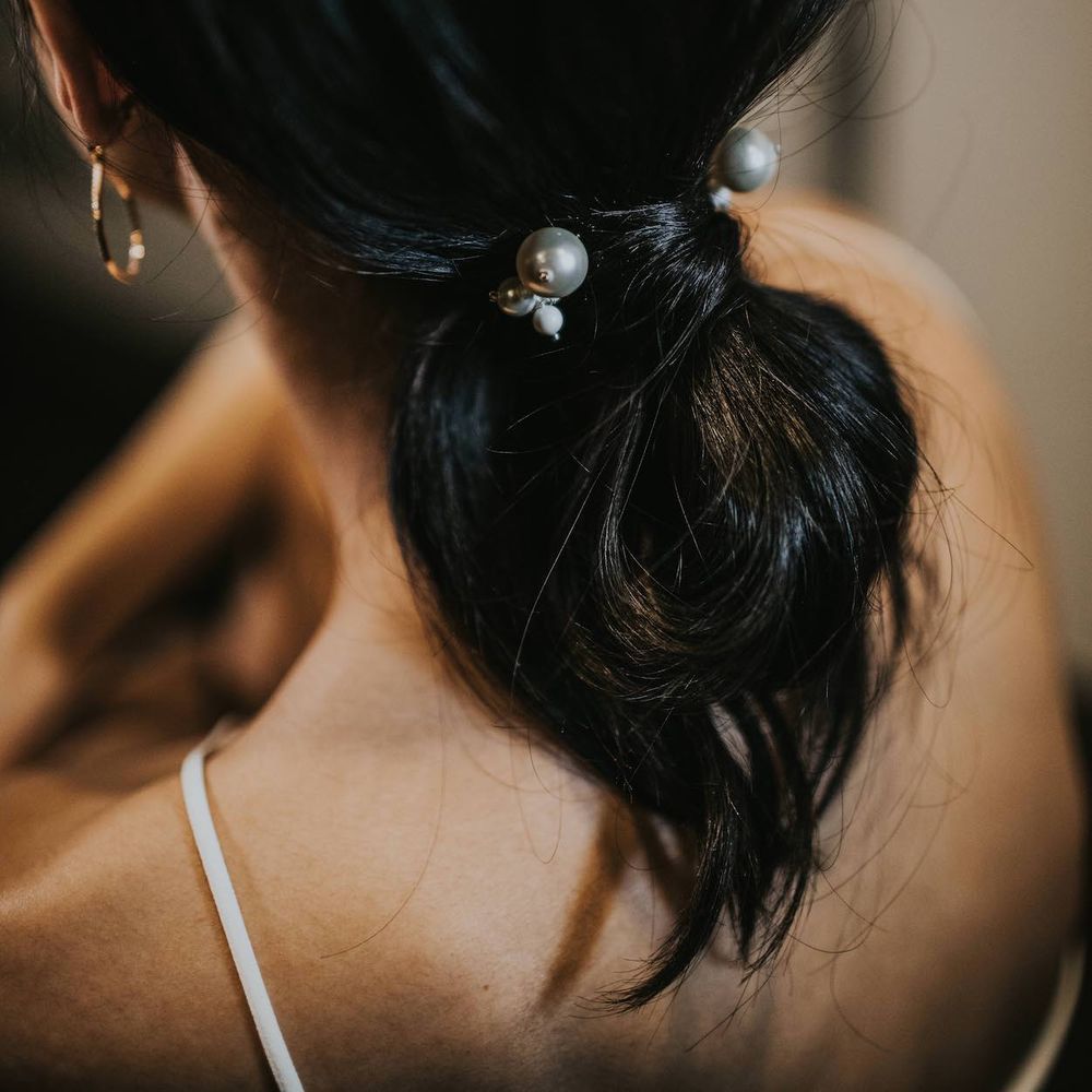 Bridal Ponytail with Pearl Hair Bobble | Minimalist Monochrome Inspiration with Anemone's &amp; White Genista Flowers styled by The Bijou Bride | Igor Demba Photography | Gione da Silva  Film
