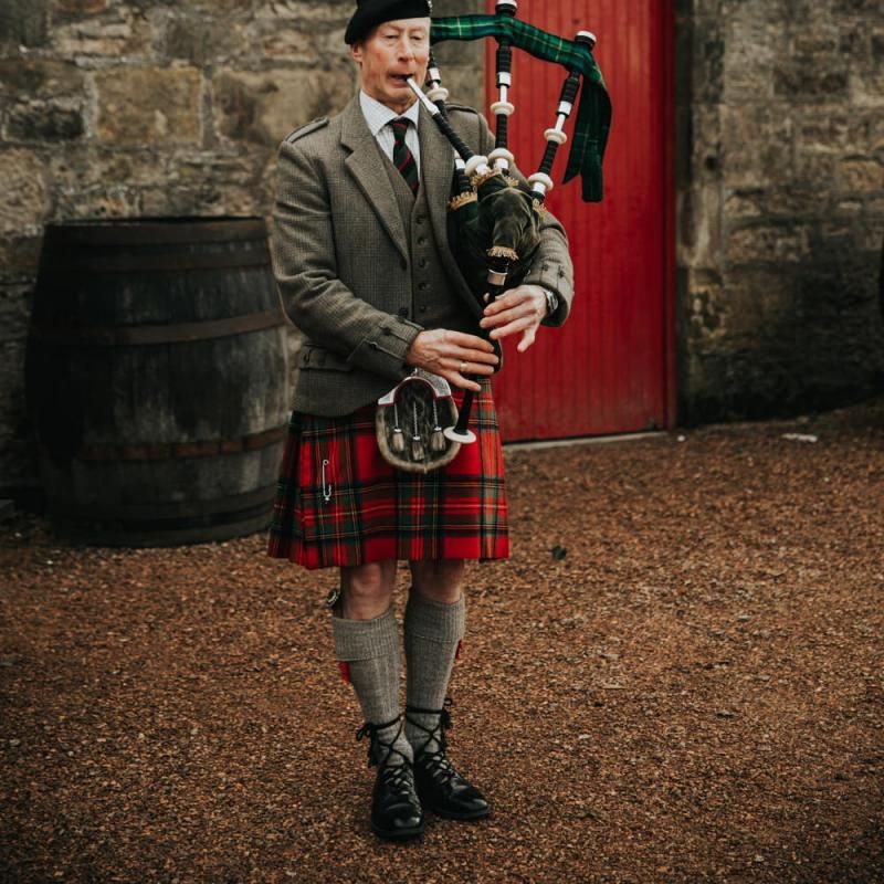 Bagpipe player at Kinkell Byre wedding in Scotland