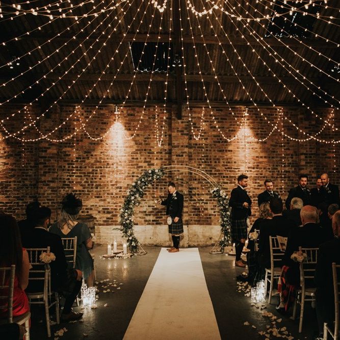 Fairy light canopy and moon gate at Kinkell Byre wedding ceremony