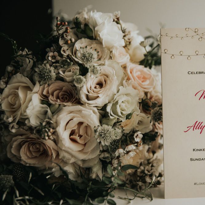 Bridal bouquet with wedding invitation at Kinkell Byre wedding