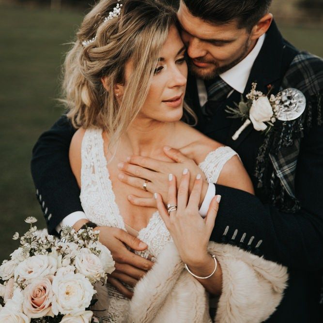 Bride and groom in traditional Scottish kilt