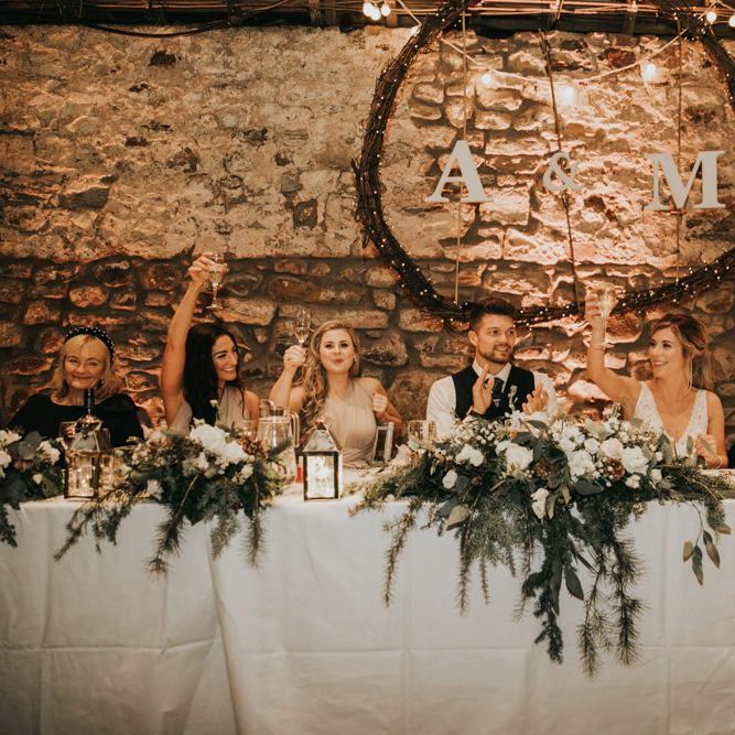Top table wedding decor with hanging hoops