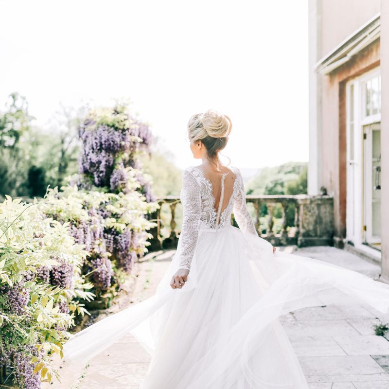 Bride in Lace Back and Tulle Skirt Wedding Dress with Pinned Bridal Bun Up do