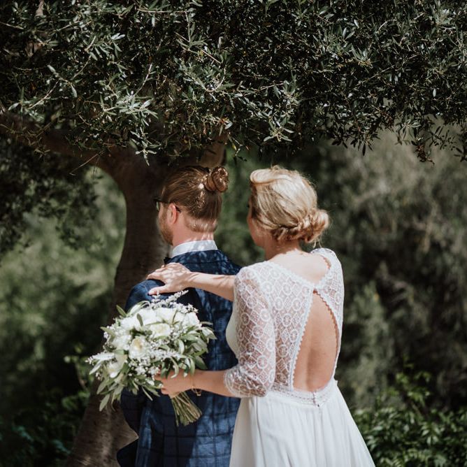 First Look with Bride in Keyhole Lace Back Rembo Styling Wedding Dress Approaching Her Groom