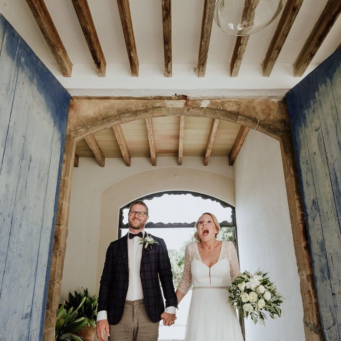 Bride in Rembo Styling Wedding Dress  and Groom  in Chino's and Checked Blazer