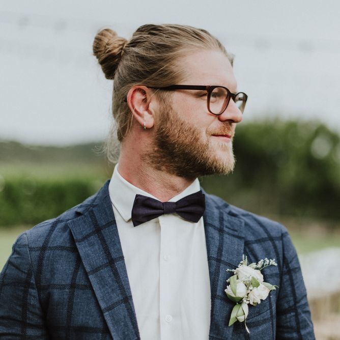 Stylish Groom in Navy Check Blazer, Bow Tie, Top Knot &amp; Glasses