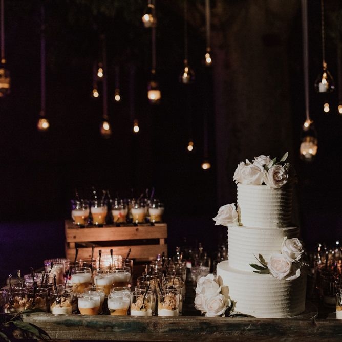 Dessert Table with White Wedding Cake and Individual Treats