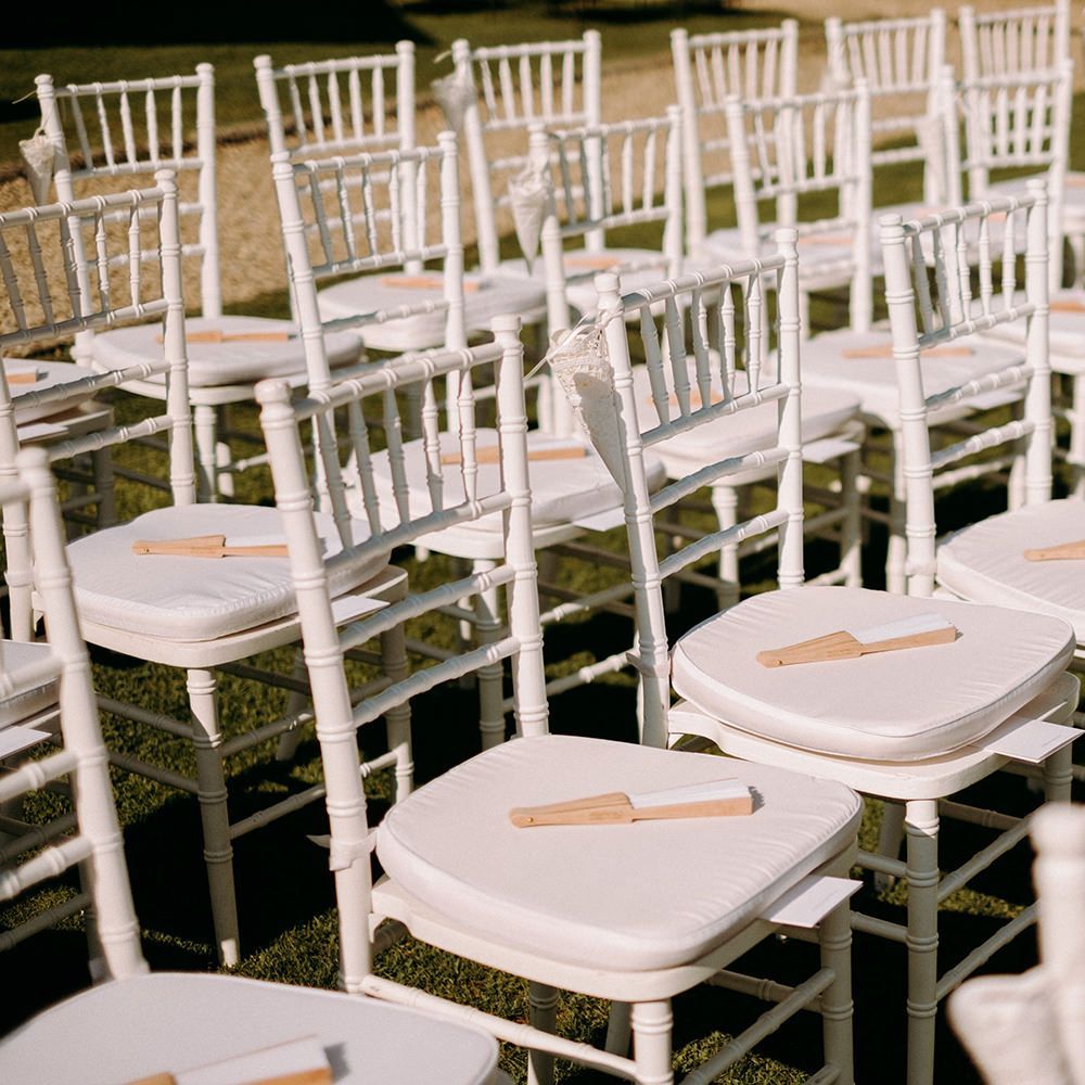 Outdoor wedding ceremony in Florence with fans for guests