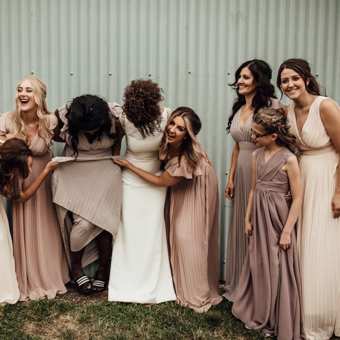 Bridesmaids In Neutral Dresses // Caribbean Influenced Wedding Kingsthorpe Lodge Barn With Steel Band And Bride In Maggie Sottero Images From Ania Ames Photography