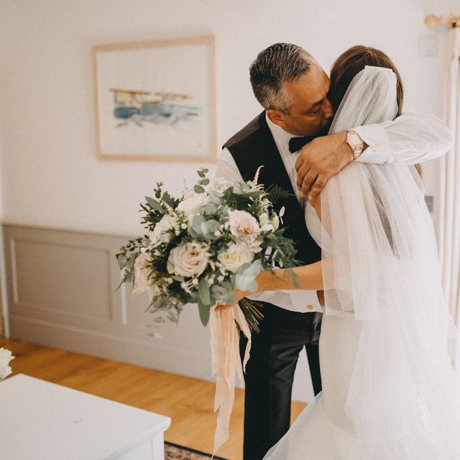 Father sees bride for first time in her dress