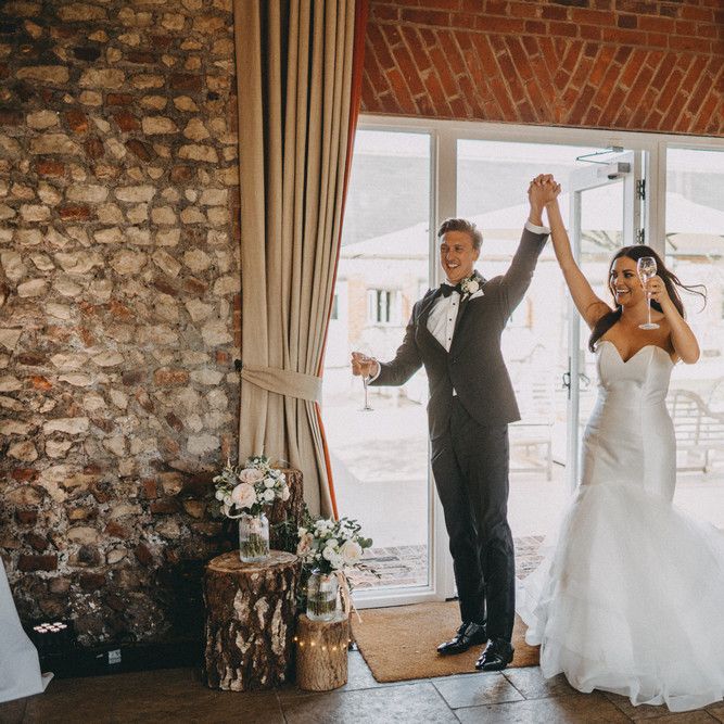 Bride and groom enter Farbridge wedding venue reception