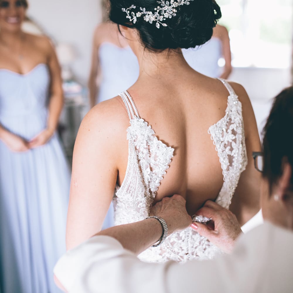 Wedding Morning Preparations | Beaded Halterneck Bridal Gown with Tulle Skirt and Spaghetti Straps by Maggie Sottero | Hair Vine from Etsy | Halterneck Maggie Sottero Dress and Garden Games at Gate Street Barn | Story + Colour Photography