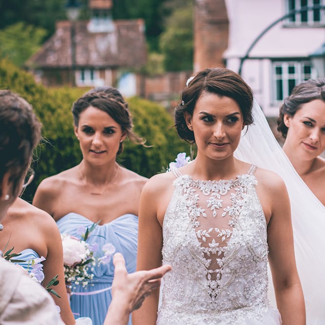 Arrival of the Bride | Beaded Halterneck Wedding Gown with Tulle Skirt and Spaghetti Straps by Maggie Sottero | Pastel Blue Bridesmaids Dresses from ASOS | Halterneck Maggie Sottero Dress and Garden Games at Gate Street Barn | Story + Colour Photography