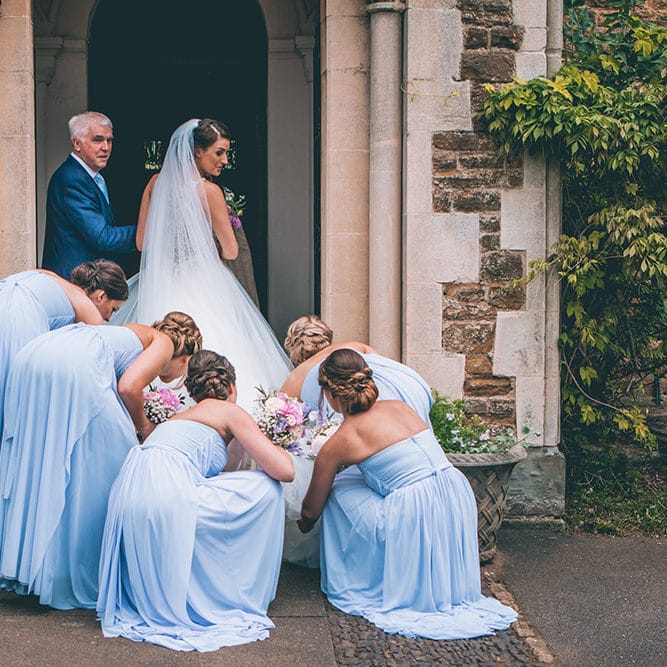 Arrival of the Bride | Beaded Halterneck Wedding Gown with Tulle Skirt and Spaghetti Straps by Maggie Sottero | Pastel Blue Bridesmaids Dresses from ASOS | Floor Length Veil | Navy Blue Suit for Father of the Bride | Pastel Wedding Bouquets | Halterneck Maggie Sottero Dress and Garden Games at Gate Street Barn | Story + Colour Photography