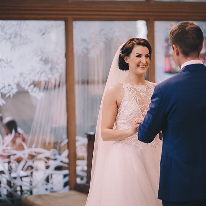 Wedding Ceremony | Bride in Beaded Halterneck Gown with Tulle Skirt and Spaghetti Straps by Maggie Sottero | Groom in Royal Blue Suit with Pastel Blue Tie from Suit Supply | Halterneck Maggie Sottero Dress and Garden Games at Gate Street Barn | Story + Colour Photography