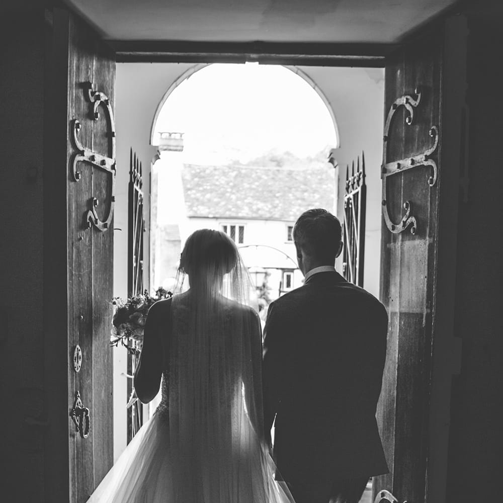 Just Married | Exit of the Bride and Groom | Bride in Beaded Halterneck Gown with Tulle Skirt and Spaghetti Straps by Maggie Sottero | Floor Length Veil | Groom in Royal Blue Suit from Suit Supply and Tan Brogues from Barker | Halterneck Maggie Sottero Dress and Garden Games at Gate Street Barn | Story + Colour Photography