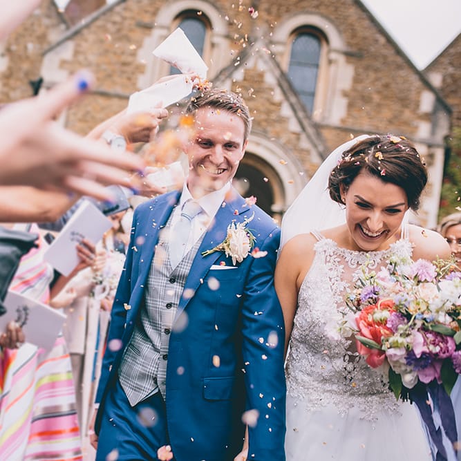 Confetti Throw | Bride in Beaded Halterneck Gown with Tulle Skirt and Spaghetti Straps by Maggie Sottero | Groom in Royal Blue Suit from Suit Supply and Tan Brogues from Barker | Halterneck Maggie Sottero Dress and Garden Games at Gate Street Barn | Story + Colour Photography