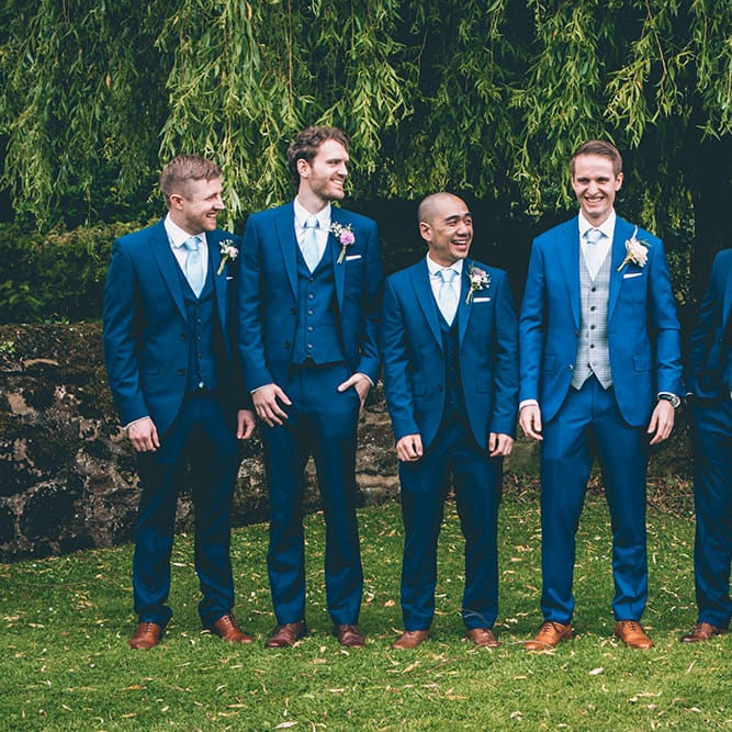 Groom in Royal Blue Suit from Suit Supply and Tan Brogues from Barker | Groomsmen in Navy Blue Suits with Pastel Blue Ties | Halterneck Maggie Sottero Dress and Garden Games at Gate Street Barn | Story + Colour Photography