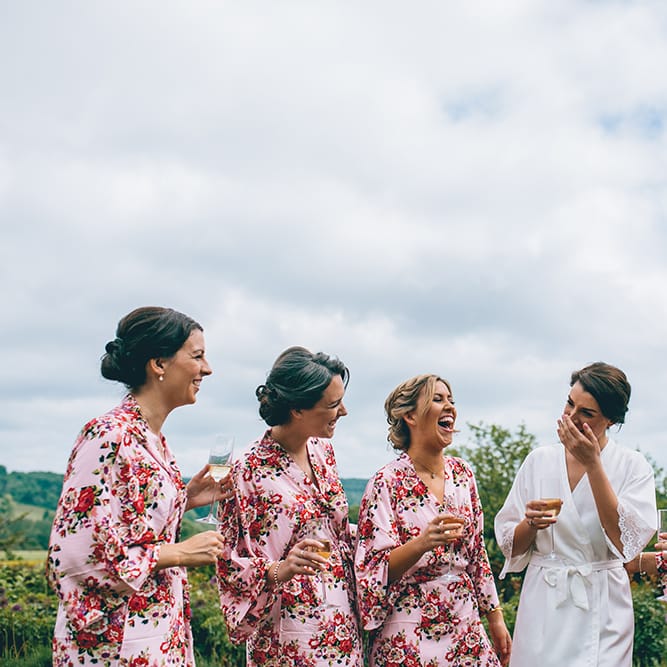 Wedding Morning Preparations | Bride in White Getting Ready Robe | Bridesmaids in Pink Floral Getting Ready Robes | Halterneck Maggie Sottero Dress and Garden Games at Gate Street Barn | Story + Colour Photography