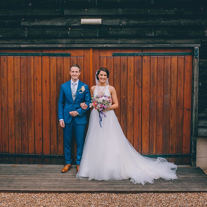 Bride in Beaded Halterneck Gown with Tulle Skirt and Spaghetti Straps by Maggie Sottero | Groom in Royal Blue Suit from Suit Supply and Tan Brogues from Barker | Pastel Wedding Bouquet with Peonies | Halterneck Maggie Sottero Dress and Garden Games at Gate Street Barn | Story + Colour Photography