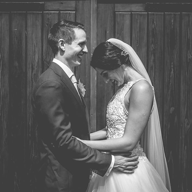 Bride in Beaded Halterneck Gown with Tulle Skirt and Spaghetti Straps by Maggie Sottero | Groom in Royal Blue Suit from Suit Supply and Tan Brogues from Barker | Floor Length Veil | Halterneck Maggie Sottero Dress and Garden Games at Gate Street Barn | Story + Colour Photography