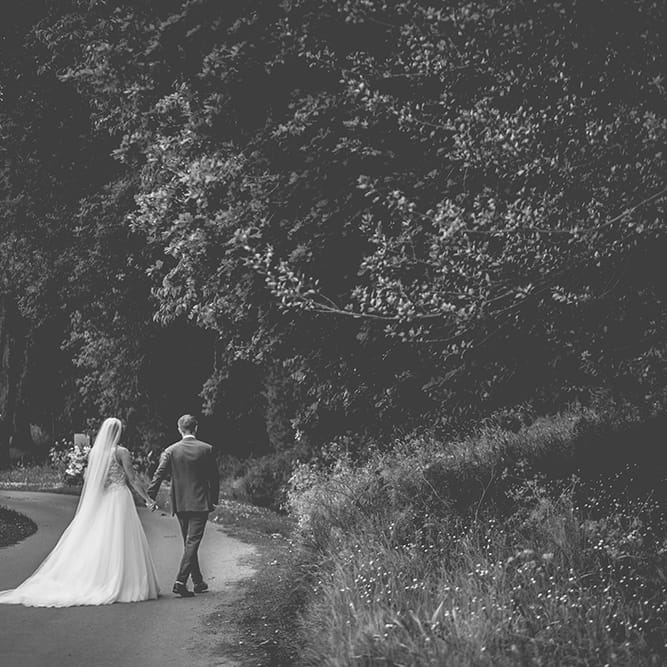 Bride in Beaded Halterneck Gown with Tulle Skirt and Spaghetti Straps by Maggie Sottero | Groom in Royal Blue Suit from Suit Supply and Tan Brogues from Barker | Floor Length Veil | Halterneck Maggie Sottero Dress and Garden Games at Gate Street Barn | Story + Colour Photography