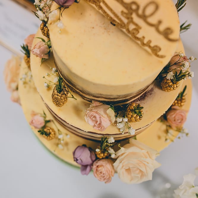 Semi Naked Wedding Cake Decorated with Pastel Flowers and Gold Painted Blackberries | Halterneck Maggie Sottero Dress and Garden Games at Gate Street Barn | Story + Colour Photography