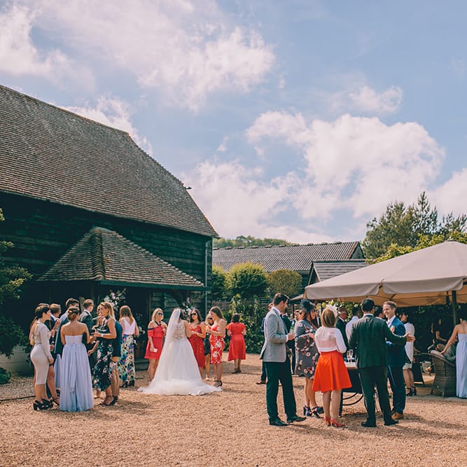 Wedding Reception at Gate Street Barn | Cocktail Hour | Bride in Beaded Halterneck Gown with Tulle Skirt and Spaghetti Straps by Maggie Sottero | Full Length Veil | Halterneck Maggie Sottero Dress and Garden Games at Gate Street Barn | Story + Colour Photography