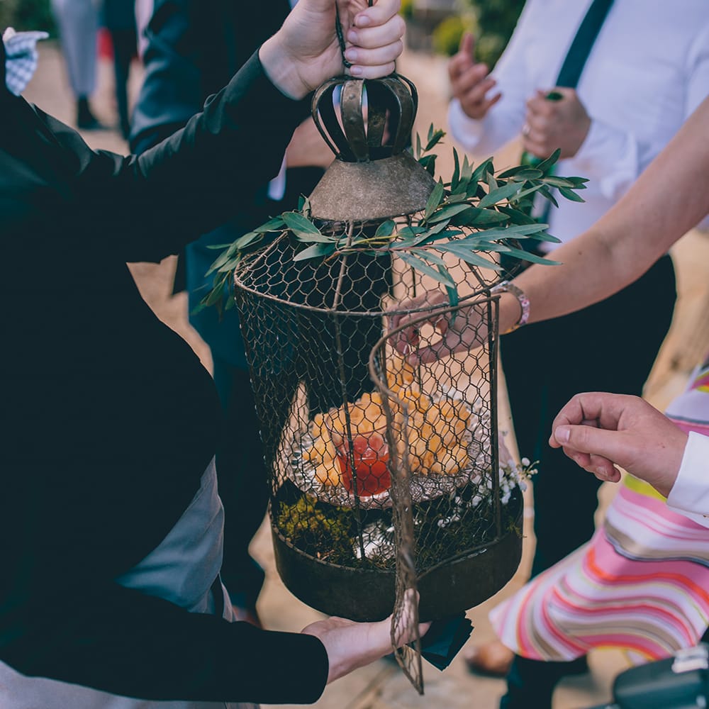 Wedding Reception at Gate Street Barn | Canapes Served in Bird Cage | Halterneck Maggie Sottero Dress and Garden Games at Gate Street Barn | Story + Colour Photography