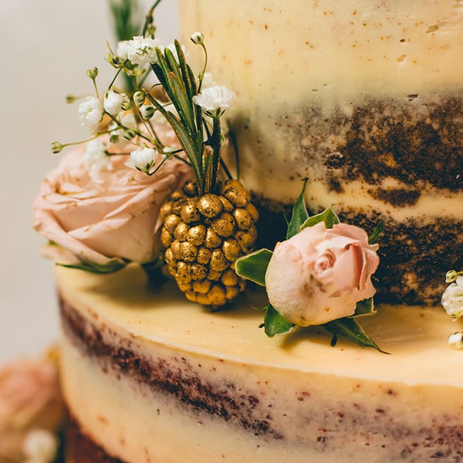 Semi Naked Wedding Cake Decorated with Pastel Flowers and Gold Painted Blackberries | Halterneck Maggie Sottero Dress and Garden Games at Gate Street Barn | Story + Colour Photography