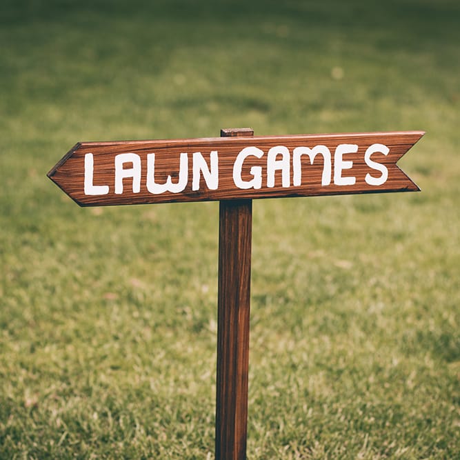 Wedding Reception Decor | Lawn Games Sign | Halterneck Maggie Sottero Dress and Garden Games at Gate Street Barn | Story + Colour Photography