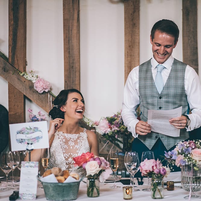 Speeches | Bride in Beaded Halterneck Gown with Tulle Skirt and Spaghetti Straps by Maggie Sottero | Groom in Royal Blue Suit and Pastel Blue Tie from Suit Supply | Top Table | Pastel Flowers | Halterneck Maggie Sottero Dress and Garden Games at Gate Street Barn | Story + Colour Photography