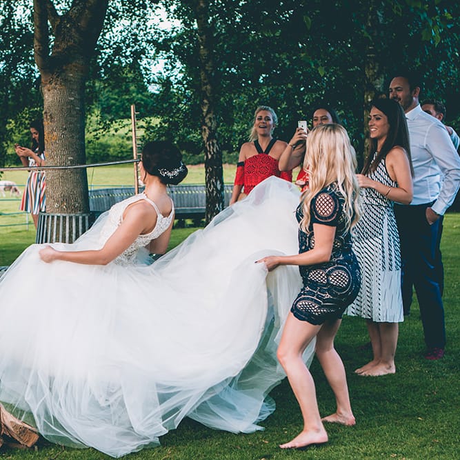 Wedding Reception | Lawn Games | Bride Doing the Limbo | Halterneck Maggie Sottero Dress and Garden Games at Gate Street Barn | Story + Colour Photography