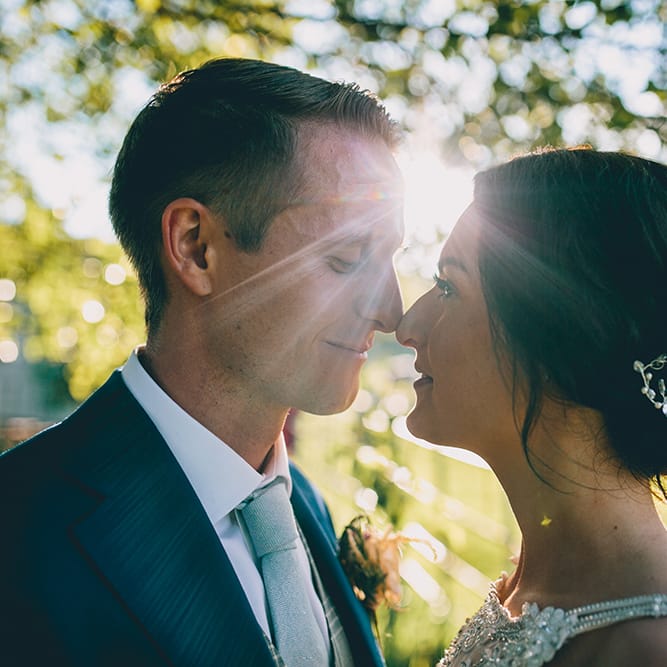 Bride in Beaded Halterneck Gown with Tulle Skirt and Spaghetti Straps by Maggie Sottero | Groom in Royal Blue Suit and Pastel Blue Tie from Suit Supply | Hair Vine from Etsy | Halterneck Maggie Sottero Dress and Garden Games at Gate Street Barn | Story + Colour Photography