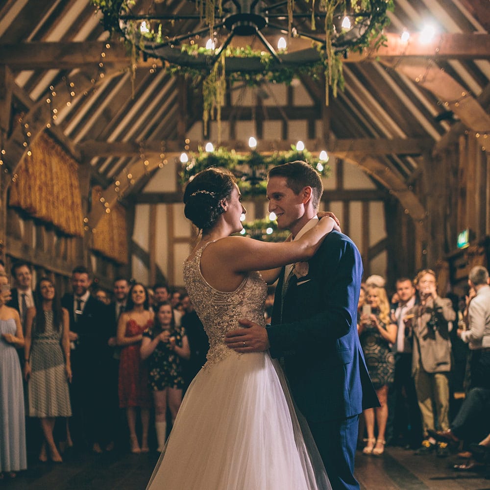 First Dance | Bride in Beaded Halterneck Gown with Tulle Skirt and Spaghetti Straps by Maggie Sottero | Groom in Royal Blue Suit and Pastel Blue Tie from Suit Supply | Hair Vine from Etsy | Foliage Light Installation | Halterneck Maggie Sottero Dress and Garden Games at Gate Street Barn | Story + Colour Photography