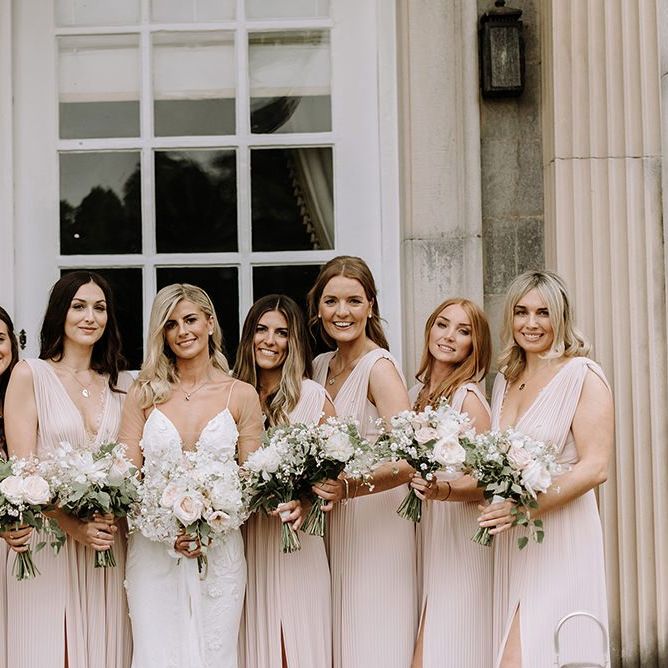 Bridal Party in Pink Bridesmaid Dresses Holding Blush Bouquet