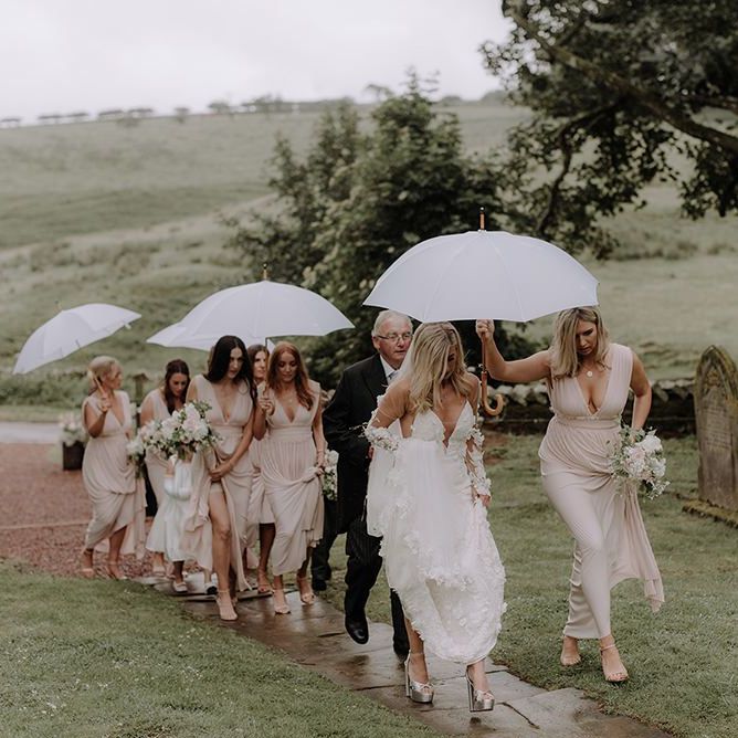 Bridal Party Arriving at Church in Rain with Umbrellas