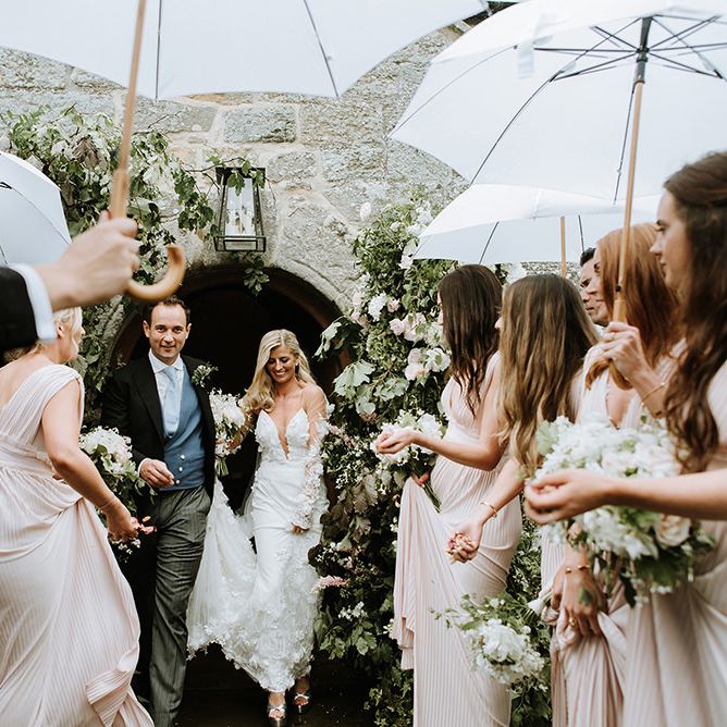 Bride and Groom Exiting Church Wedding to Confetti