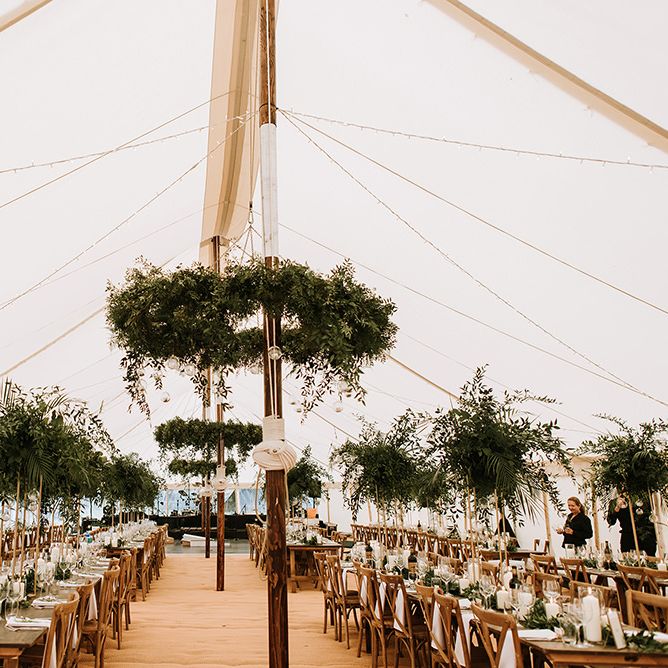 Tent Wedding With Foliage Table Decor and Hanging Decoration