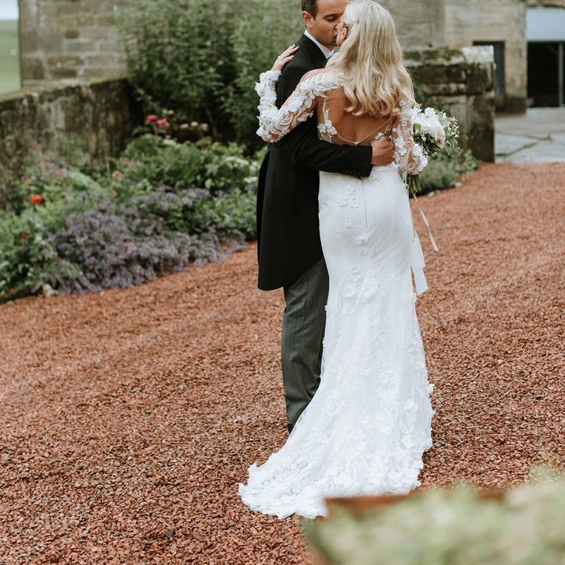 Bride and Groom with Low Back Riki Dalal Dress