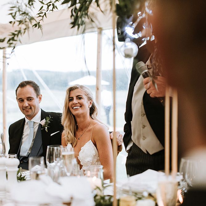 Bride and Groom on Top Table during Speeches with Floral and Foliage Decoration