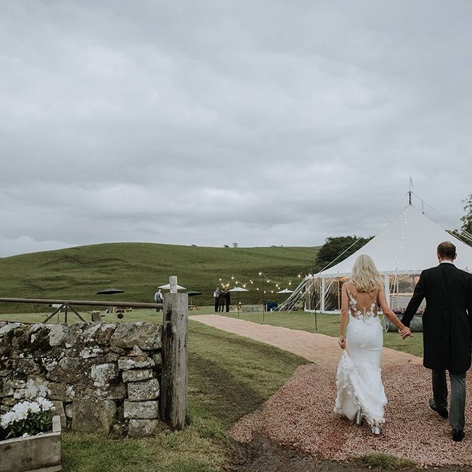 Bride and Groom in Front of Tent