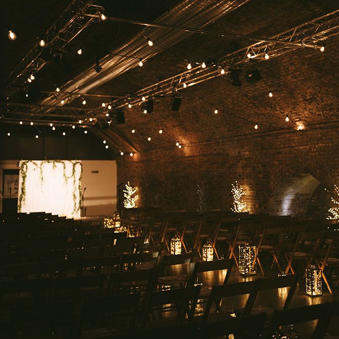 Ceremony Set-up at The Bike Shed Motorcycle Club in Shoreditch | Festoon Lights | Lanterns | Walled Arches | Bike Shed Motorcycle Club Wedding for ELLE Digital Editor | Nigel John Photography