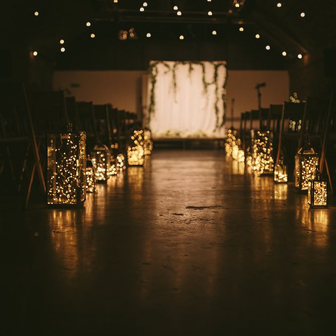 Ceremony Set-up at The Bike Shed Motorcycle Club in Shoreditch | Festoon Lights | Lanterns Filled with Fairylights | Bike Shed Motorcycle Club Wedding for ELLE Digital Editor | Nigel John Photography