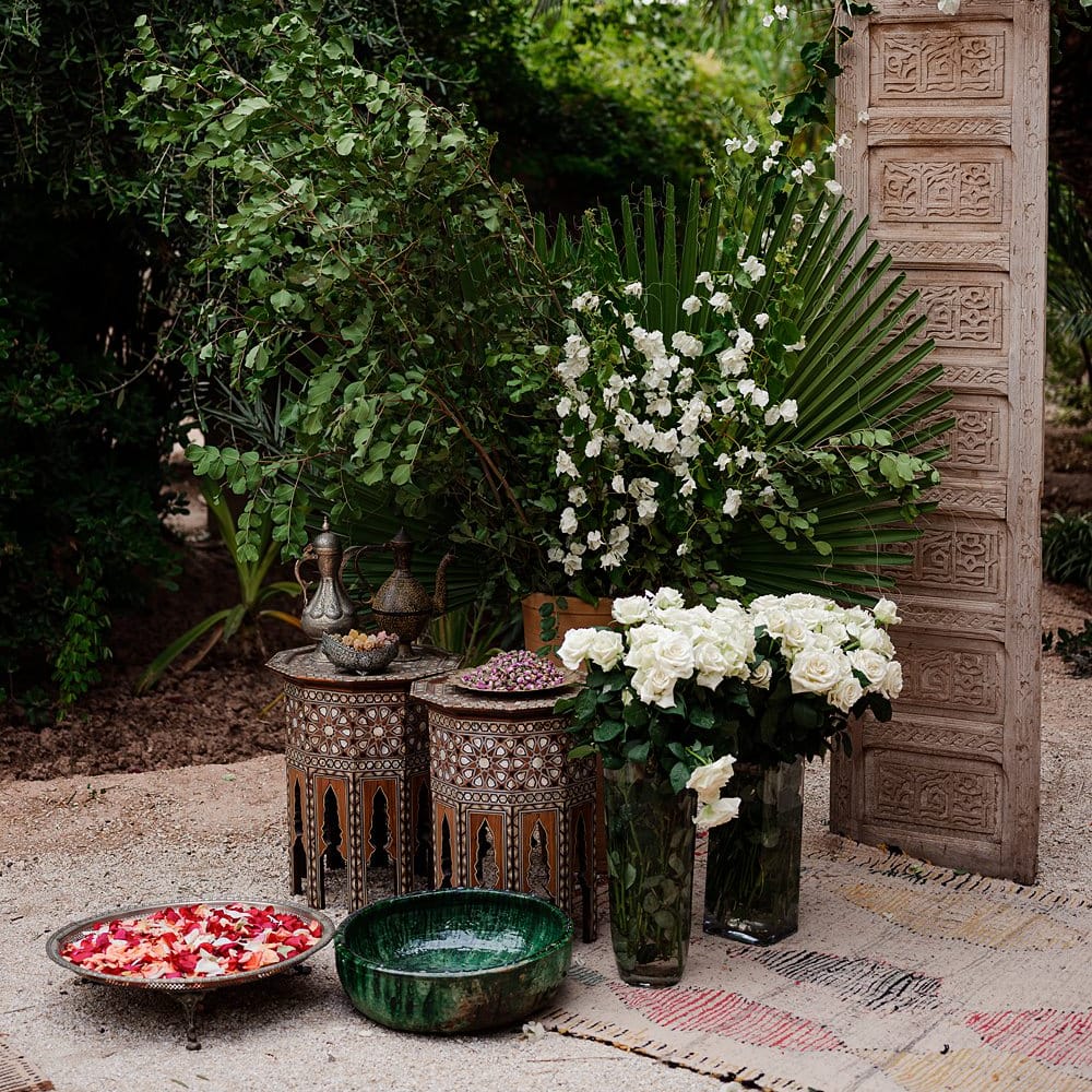 Ceramic Pots | Wooden Door Altar | Moroccan Rugs | Outdoor Ceremony Wedding Decor | Paradise Destination Wedding at Jnane Tamsna in Marrakech, Morocco | Nordica Photography | Matteo Castelluccia Film