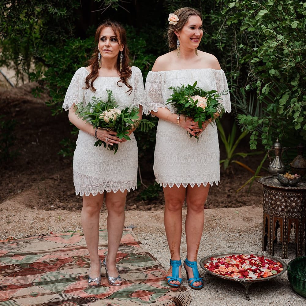 Outdoor Wedding Ceremony | Bridesmaids in White Vero Moda Dresses |  Paradise Destination Wedding at Jnane Tamsna in Marrakech, Morocco | Nordica Photography | Matteo Castelluccia Film
