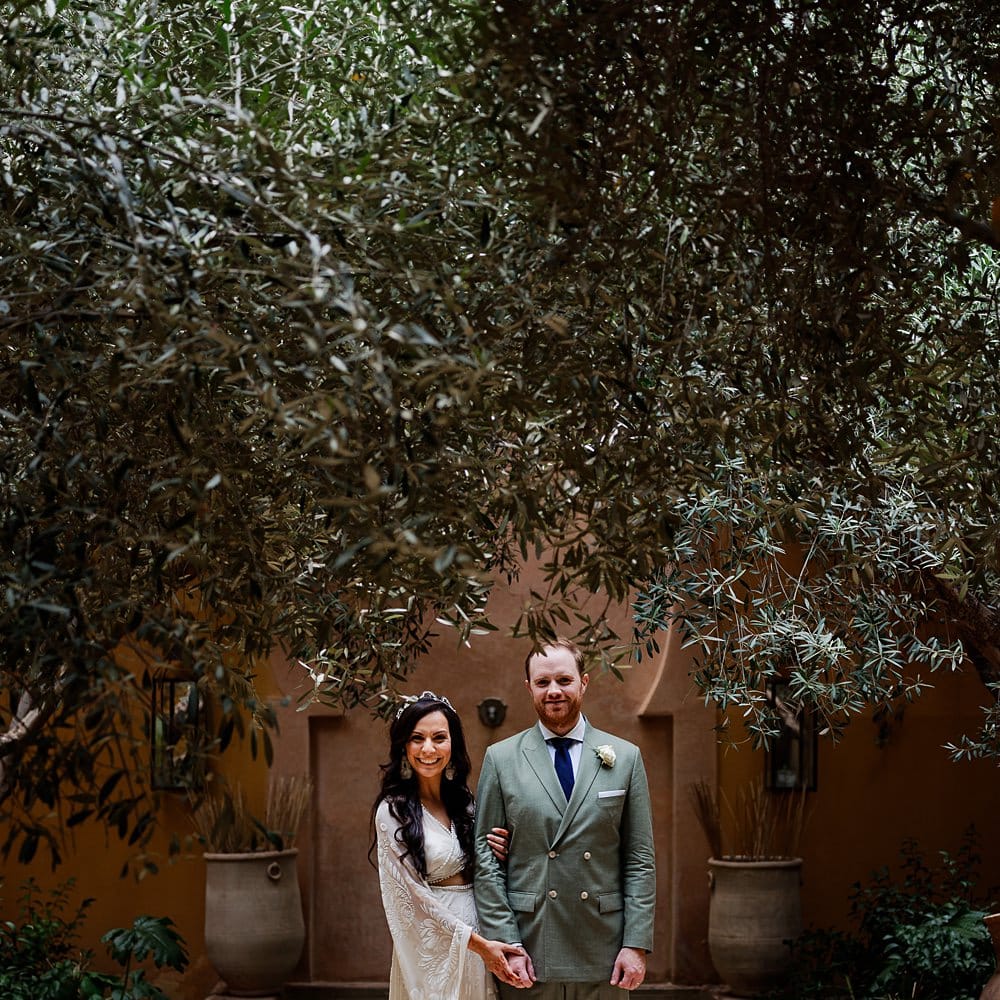 Bride in rue de Seine Bridal Gown | Groom in Green Beggars Run Suit | Paradise Destination Wedding at Jnane Tamsna in Marrakech, Morocco | Nordica Photography | Matteo Castelluccia Film