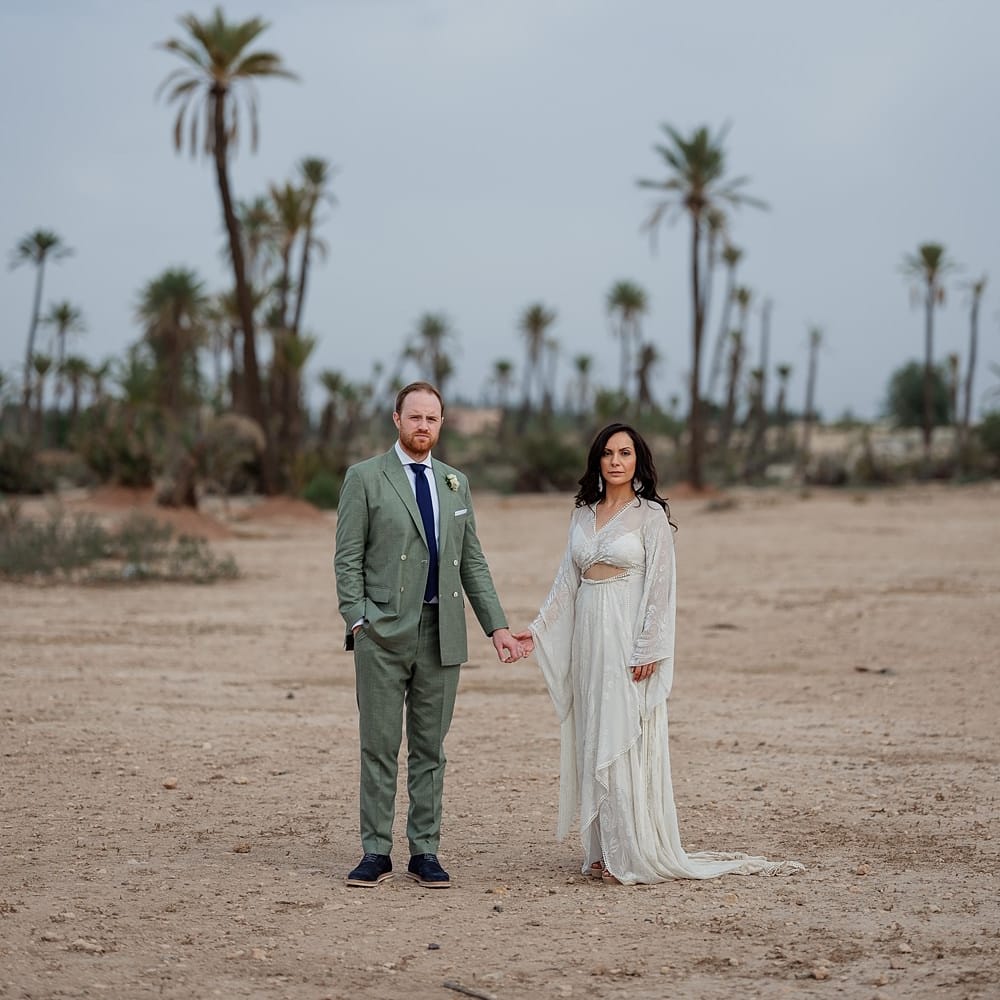 Bride in rue de Seine Bridal Gown | Groom in Green Beggars Run Suit | Paradise Destination Wedding at Jnane Tamsna in Marrakech, Morocco | Nordica Photography | Matteo Castelluccia Film